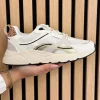 Sneakers white with gold combination